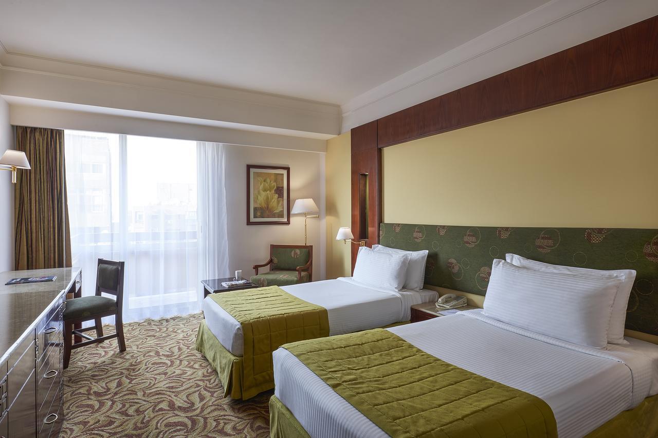 Safir Hotel Cairo Giza Bagian luar foto Deluxe Room