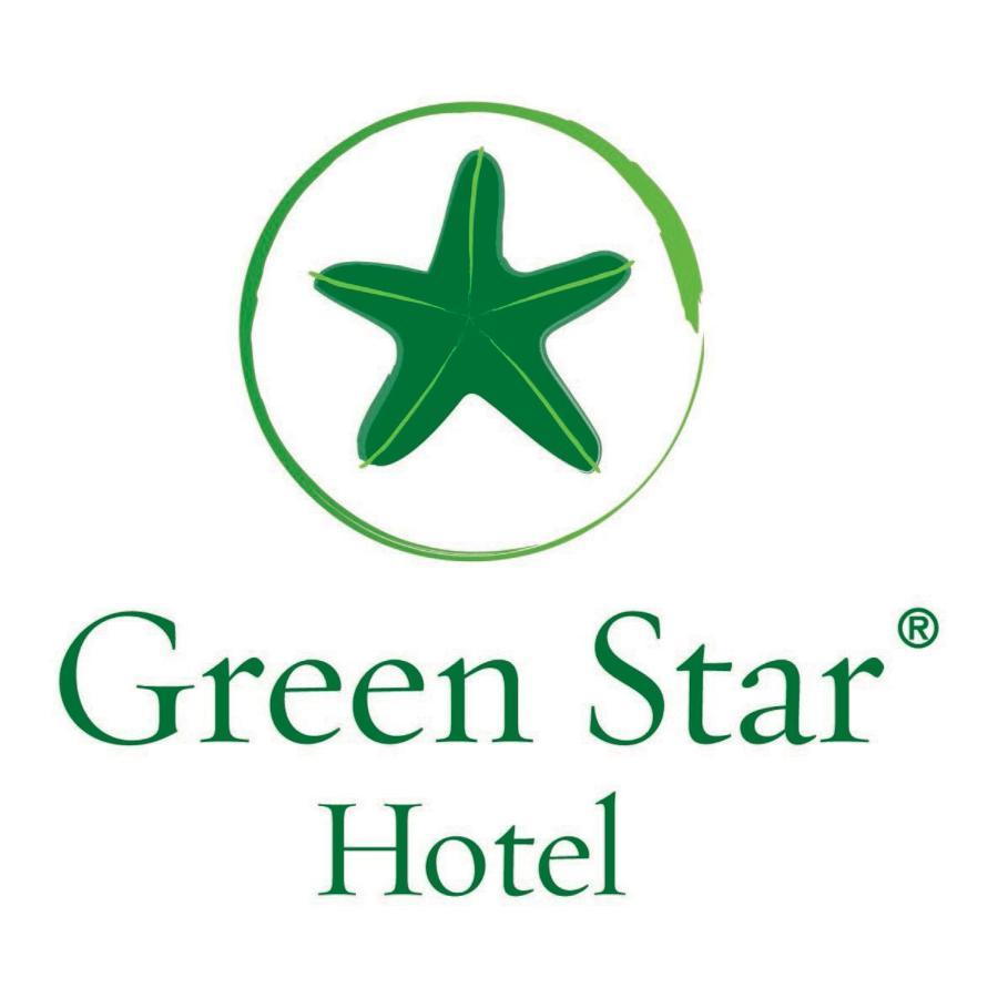 Safir Hotel Cairo Giza Bagian luar foto The image shows the logo of "Green Star Hotel." It features a green star, likely a stylized sea star, positioned above the text. The name "Green Star" is displayed prominently, with "Hotel" underneath it, all in a clean and simple font. The overall d
